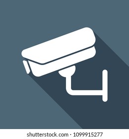 Security camera. Technology icon. White flat icon with long shadow on background