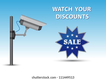 Security cctv camera with open lens and wires on pole. Blue sticker with text Sale and au above text Watch Your Discounts.