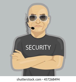 Security guard standing with crossed arms and glasses