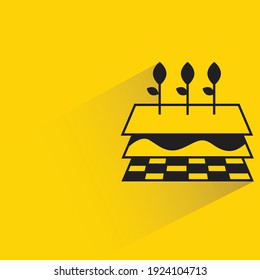 seed plant in soil layers with shadow on yellow background
