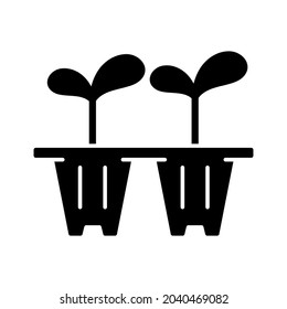 Seedling trays black glyph icon. Temporary containers that hold plants from seed to seedling stage. Seeds are transferred from trays. Silhouette symbol on white space. Vector isolated illustration