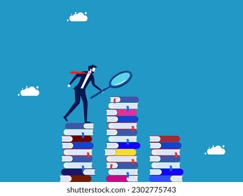 Seeking knowledge and gathering information. Businessman using magnifying glass to find information on stack of books