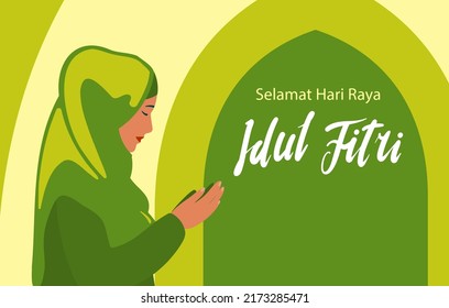 Selamat hari raya idul fitri means happy eid mubarak in Indonesian. Cartoon Muslim women.