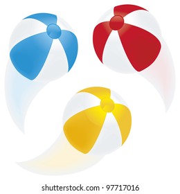 A selection of beach balls in motion with blurred paths isolated on white.