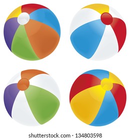 A selection of beach balls in multiple colors isolated on white.