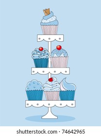 A selection of delicious cupcakes and muffins presented on multi-tiered display stand. svg