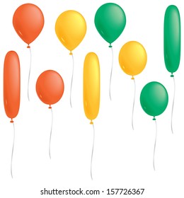 A selection of orange, yellow and green balloons isolated on white.