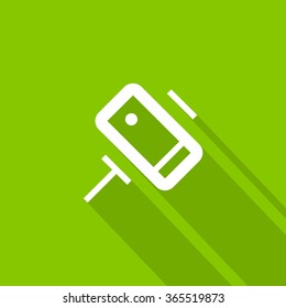 a self mobile phone in a holder self isolated minimal single flat linear icon in color. Line vector icon for websites and mobile minimalistic flat design.