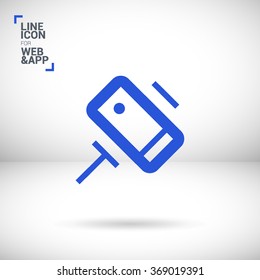a self mobile phone in a holder self isolated minimal single flat linear icon in color. Line vector icon for websites and mobile minimalistic flat design.