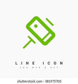 a self mobile phone in a holder self isolated minimal single flat linear icon in color. Line vector icon for websites and mobile minimalistic flat design.