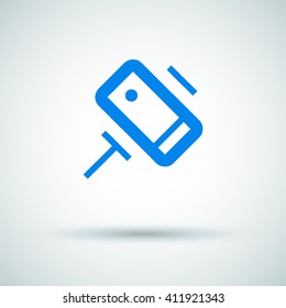 a self mobile phone in a holder self isolated minimal single flat linear icon in color. Line vector icon for websites and mobile minimalistic flat design.