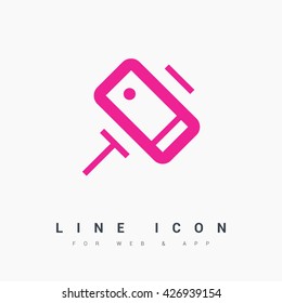 a self mobile phone in a holder self isolated minimal single flat linear icon in color. Line vector icon for websites and mobile minimalistic flat design.