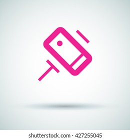 a self mobile phone in a holder self isolated minimal single flat linear icon in color. Line vector icon for websites and mobile minimalistic flat design.