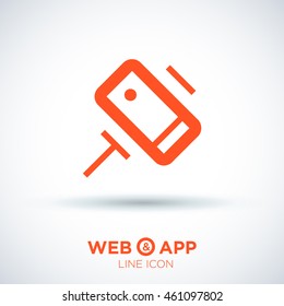 a self mobile phone in a holder isolated minimal single flat linear icon in color. Line vector icon for websites and mobile minimalistic flat design.