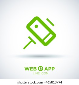 a self mobile phone in a holder self isolated minimal single flat linear icon in color. Line vector icon for websites and mobile minimalistic flat design.