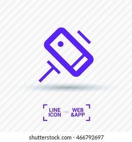 a self mobile phone in a holder self isolated minimal single flat linear icon in color. Line vector icon for websites and mobile minimalistic flat design.