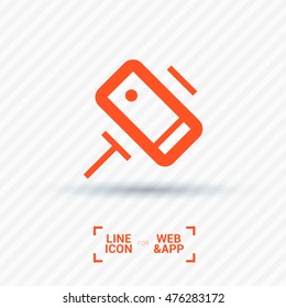 a self mobile phone in a holder self isolated minimal single flat linear icon in color. Line vector icon for websites and mobile minimalistic flat design.