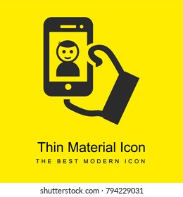 Selfie of a boy on phone screen in his hand bright yellow material minimal icon or logo design