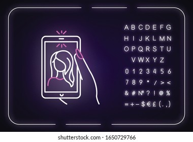 Selfie neon light icon. Outer glowing effect. Sign with alphabet, numbers and symbols. Self photo, front camera picture. Young girl portrait on smartphone screen vector isolated RGB color illustration