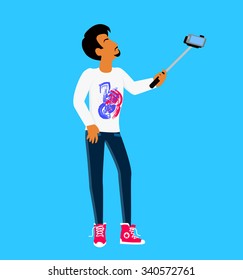 Selfie on smartphone using monopod. Modern life with selfie photo camera. Young man taking own self portrait with mobile phone and stick. Selfie smile, selfie concept. Man standing and photographed