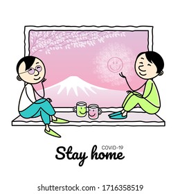 Self-isolation from a pandemic. Two Japanese are sitting on a windowsill overlooking Fuji. Smiling face on the window. Coronavirus pandemic. Stay home in quarantine to stop the spread of the virus