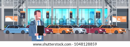 Seller Man In Cars Dealership Center Showroom Interior Over Set Of New Modern Vechicles Horizontal Banner