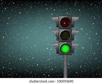 Semaphore with included green on a background of snow. Winter abstract landscape