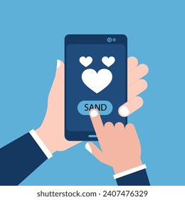 Sending love message concept. Hand holding phone with heart, send button on the screen. Finger touch screen