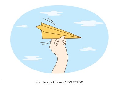 Sending paper airplane concept. Human hand starting flight of paper aircraft plane over blue air background. Freedom, new project, success, email, target illustration