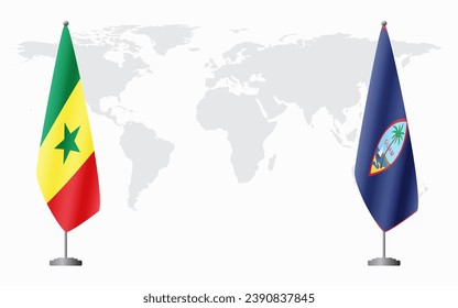 Senegal and Guam flags for official meeting against background of world map.
