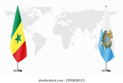 Senegal and San Marino flags for official meeting against background of world map.