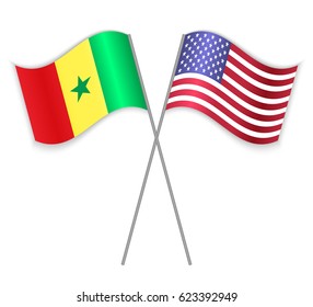 Senegalese and American crossed flags. Senegal combined with United States of America isolated on white. Language learning, international business or travel concept.