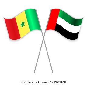 Senegalese and Emirian crossed flags. Senegal combined with United Arab Emirates isolated on white. Language learning, international business or travel concept.