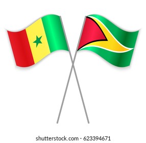 Senegalese and Guyanese crossed flags. Senegal combined with Guyana isolated on white. Language learning, international business or travel concept.