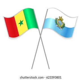 Senegalese and Sammarinese crossed flags. Senegal combined with San Marino isolated on white. Language learning, international business or travel concept.