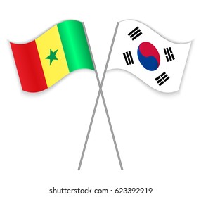 Senegalese and South Korean crossed flags. Senegal combined with South Korea isolated on white. Language learning, international business or travel concept.