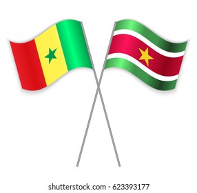Senegalese and Surinamese crossed flags. Senegal combined with Suriname isolated on white. Language learning, international business or travel concept.