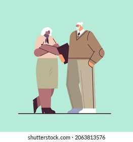 senior businesspeople discussing during meeting mix race business man woman couple in formal wear standing together