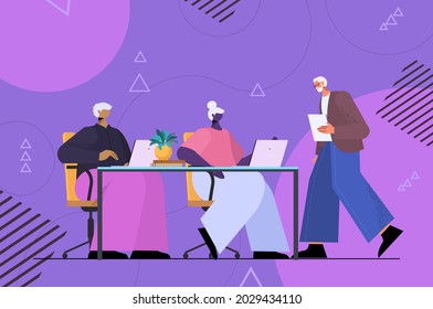 senior businesspeople team using digital gadgets aged business people working on laptops at workplace