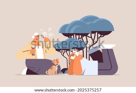 senior couple blowing bubbles and spending time with little dog relaxation retirement concept full length
