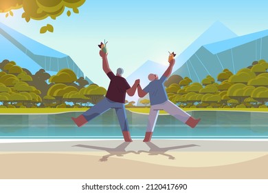 Senior Couple Dancing At Lake Beach Old African American Man And Woman Having Fun Active Old Age Concept