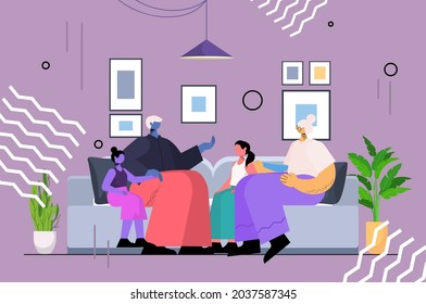 senior couple discussing with children during meeting grandparents and grandchildren spending time together