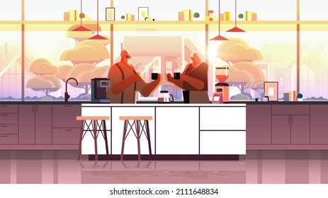 senior couple drinking coffee and talking together at home kitchen horizontal