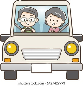 Senior couple driving in car