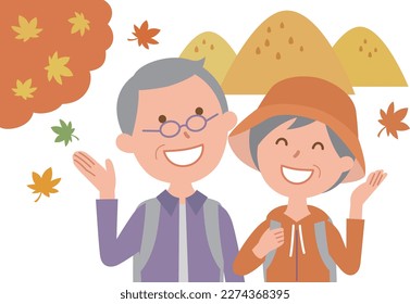 Senior couple enjoying autumn leaves