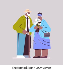 senior couple with flowers having a date african american grandparents spending time together