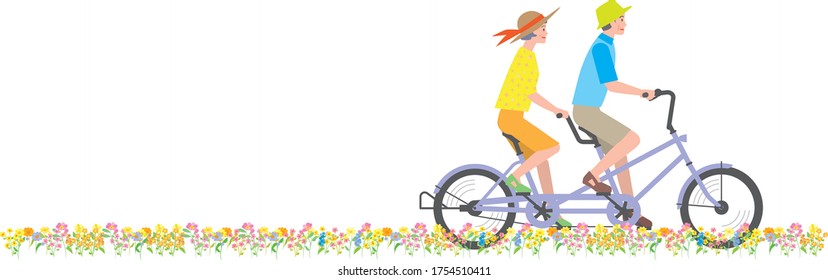 Senior couple riding a tandem bicycle in a flower garden