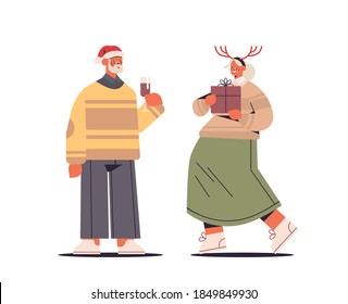 senior couple in santa claus hats having fun with presents happy new year and merry christmas holidays celebration concept horizontal full length vector illustration