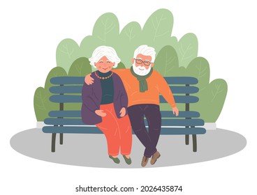 Senior couple sitting on the bench. Happy grandparents in the park