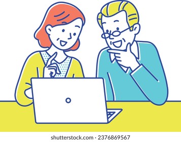 Senior couple smiling and looking at computer screen